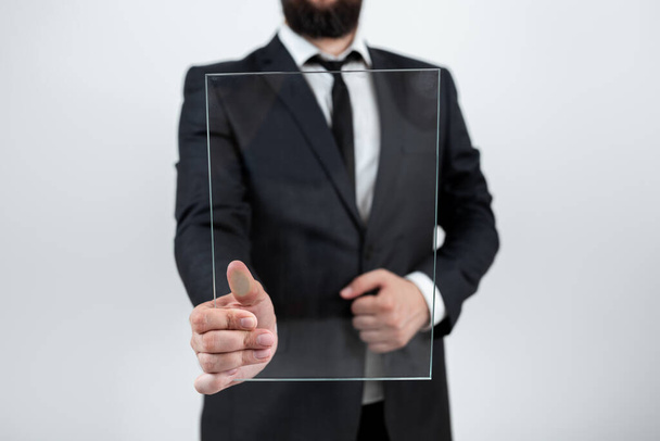 Businessman Pointing At Transparent Glass And Promoting The Brand. - Foto, Imagen