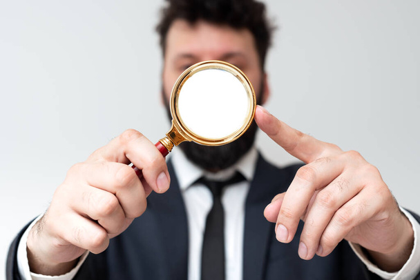Man Having Magnifying Glass To Point Important Informations. - Photo, Image
