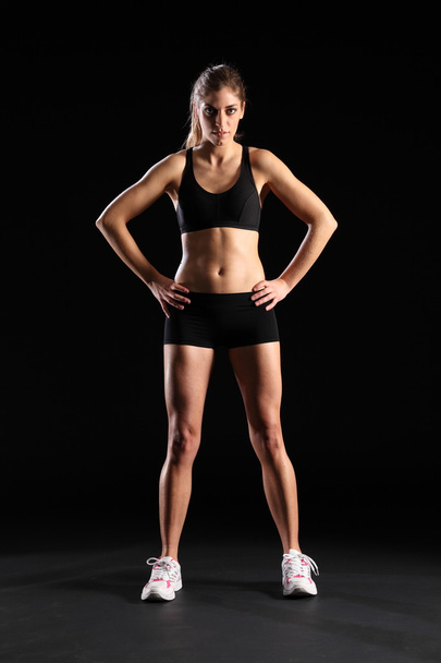 Woman in black sports outfit - Photo, Image