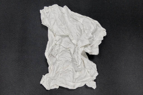 Used tissue isolated on black background. - Photo, image