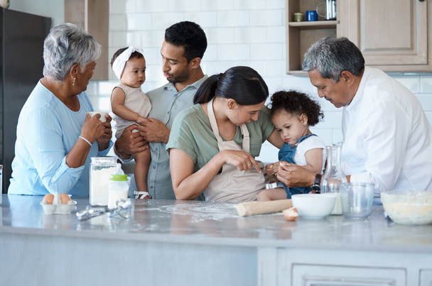 a multigenerational family baking together in the kitchen. - Photo, image