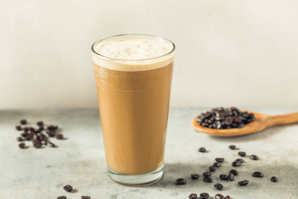 Frothy Cold Brew Nitro Coffee in a Glass - Фото, изображение