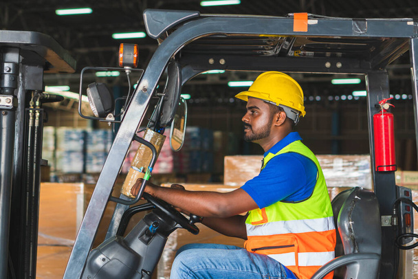 Worker on forklift, Manual workers working in warehouse, Worker driver at warehouse forklift loader works - Photo, Image