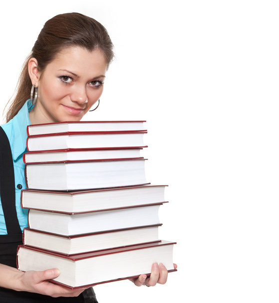 Beautiful student is holding a lot of books - Foto, Imagem