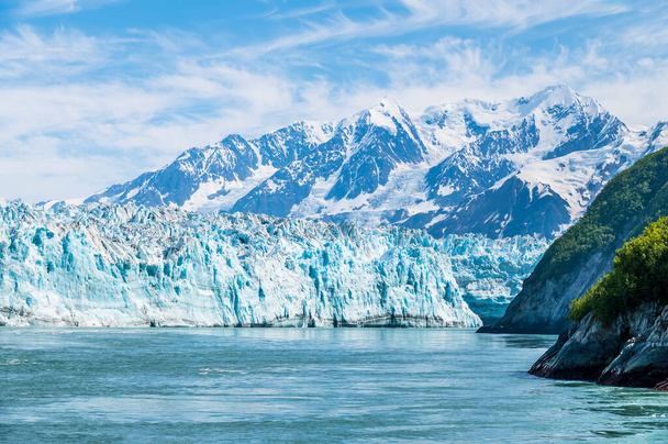A view of the end of the Hubbard Glacier from  Disenchartment Bay stretching into Russell Fjord, Alaska in summertime - Photo, Image