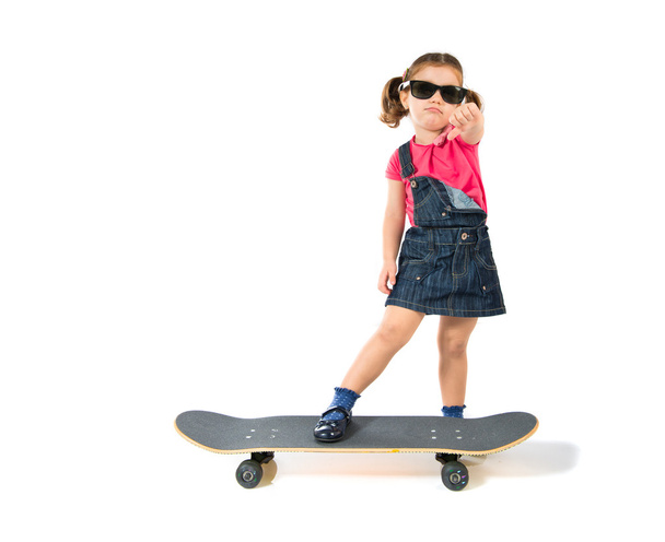 Blonde kid with skate over white background - Photo, Image