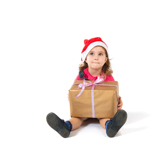 Blonde christmas kid with present - Foto, Imagen