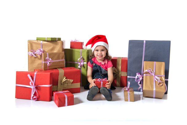 Blondi joulu lapsi ympäri useita lahjoja
 - Valokuva, kuva