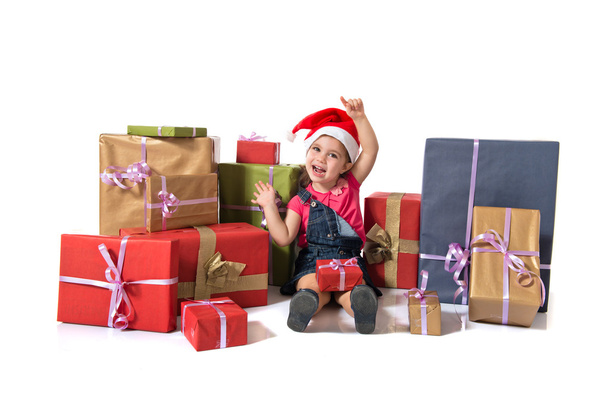 Blonde christmas kid around presents - Фото, изображение