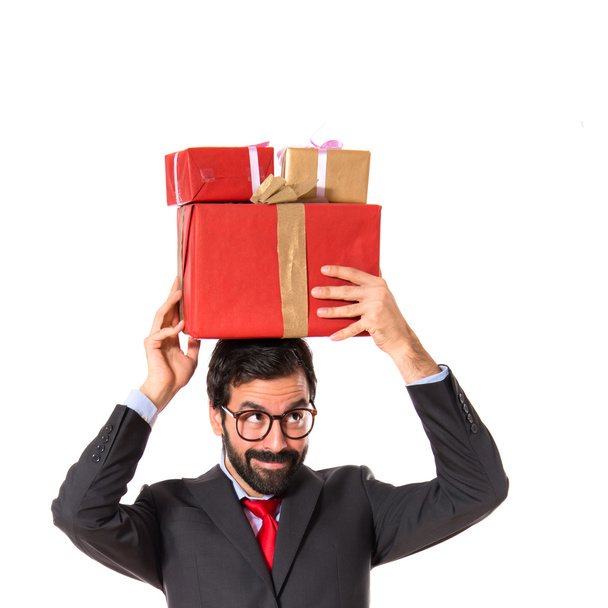 Businessman with several gifts - Photo, Image