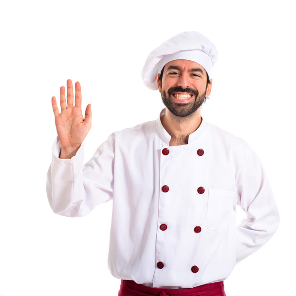Chef saluant sur fond blanc
 - Photo, image