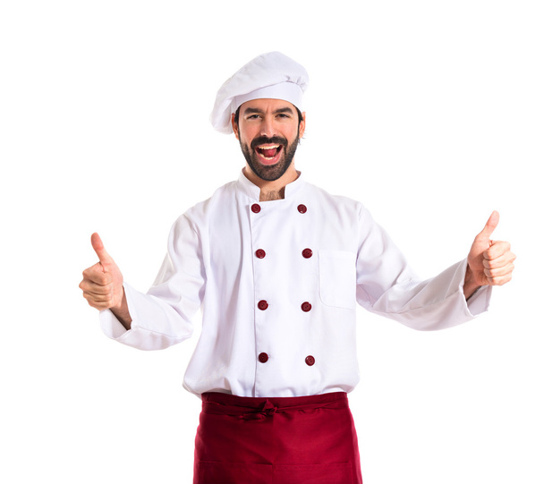 Chef with thumb up over white background - Photo, image