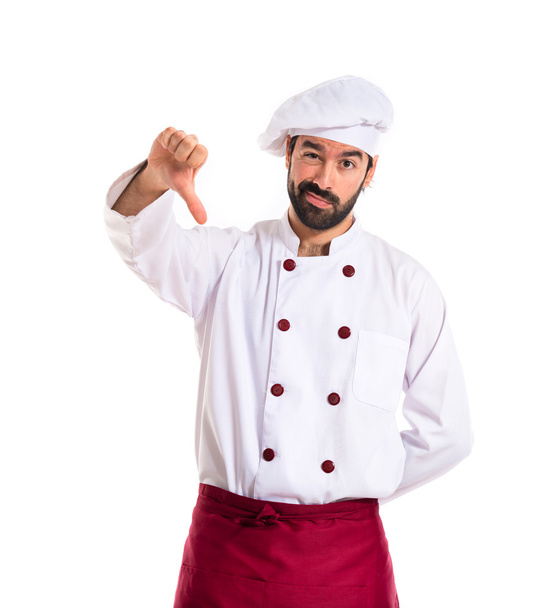Chef fazendo um mau sinal sobre fundo branco
 - Foto, Imagem