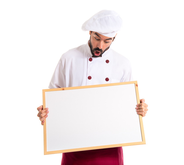 Chef holding empty placard - Fotoğraf, Görsel