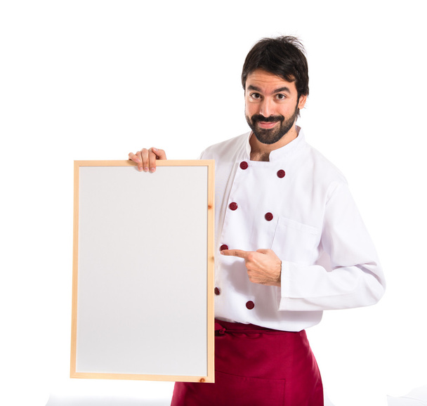 Schöner Koch mit leerem Plakat - Foto, Bild