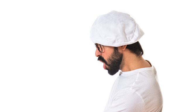 Boos chef-kok schreeuwen op witte achtergrond - Foto, afbeelding
