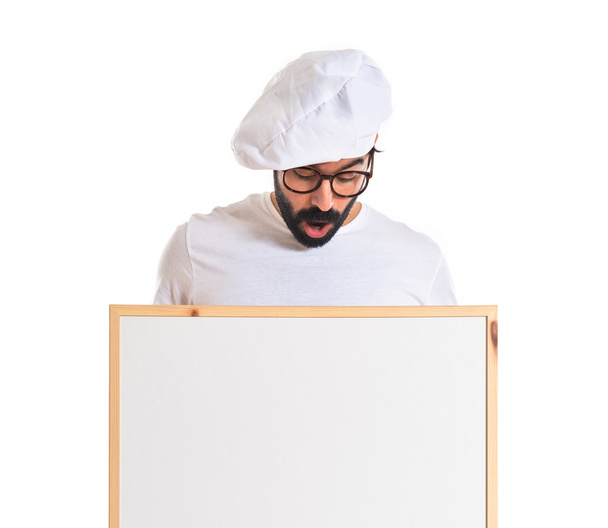 Chef surpreso segurando cartaz vazio
 - Foto, Imagem