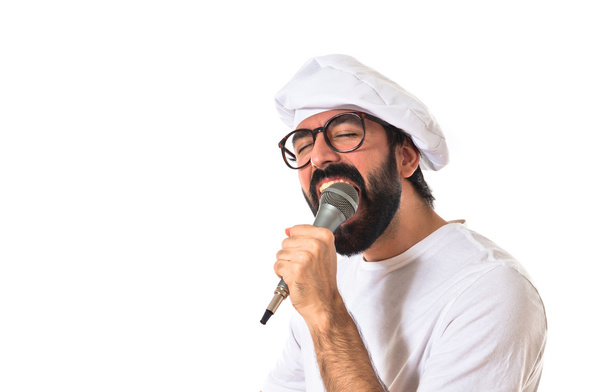 Chef singing over white background - Foto, Imagem
