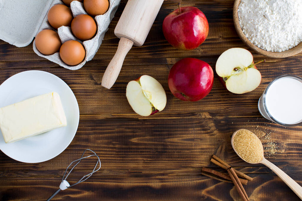 Top view of ingredients for making apple pie or cake on the wooden  background. Copy space. - Photo, Image