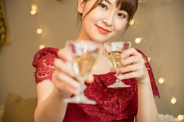 Young woman with a glass (image of night work) - Foto, Imagem
