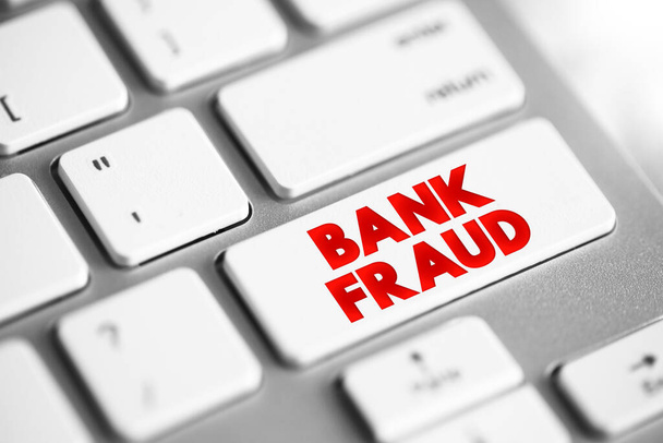 Bank Fraud - use of potentially illegal means to obtain money, assets, or other property owned or held by a financial institution, text concept button on keyboard - 写真・画像