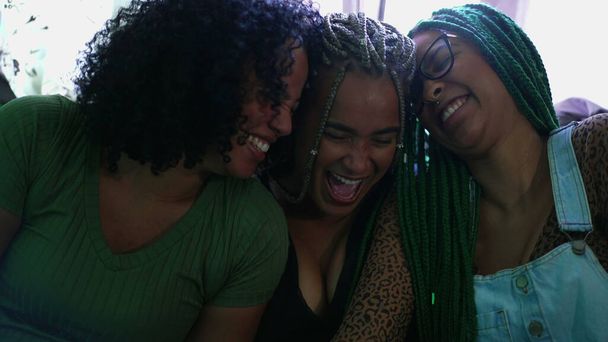Girlfriends laughing together. Three black women smiling. Real life happiness emotion - Fotografie, Obrázek