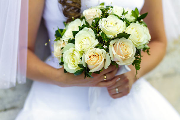 Bride holding beautiful bouquet of roses - Фото, зображення