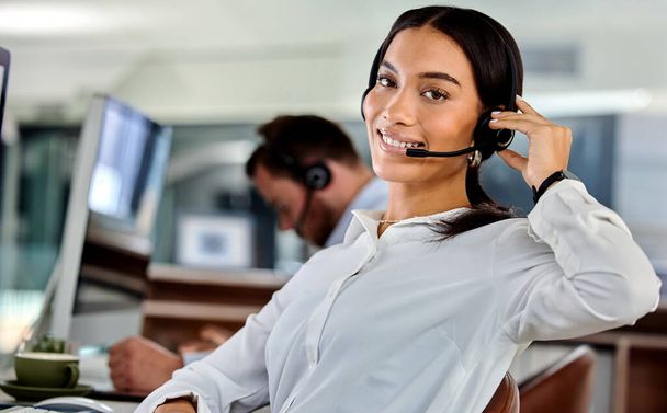 Ready to make your day. a young businesswoman working in a call center - Foto, imagen