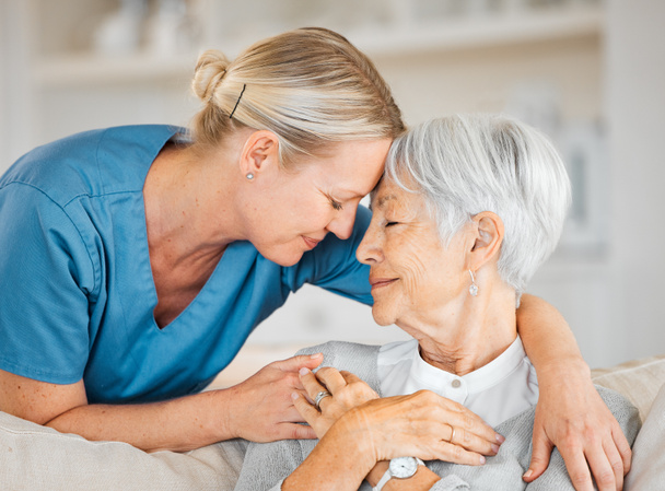 a nurse caring for a senior woman at home. - Photo, Image