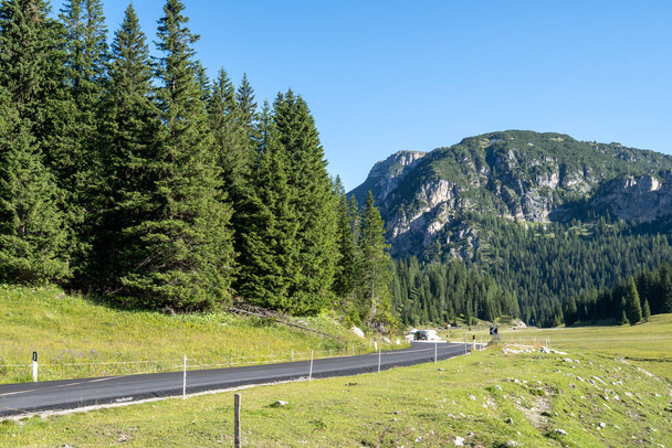 Car roads winding through the Dolomites mountain in Italy - 写真・画像