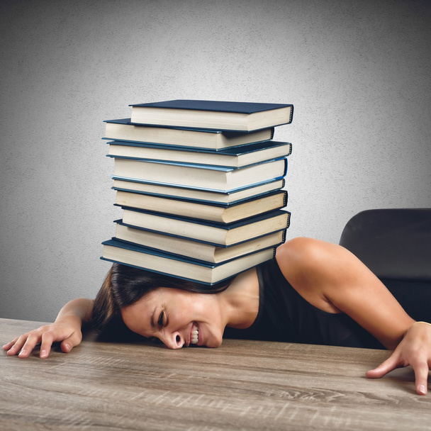Women crushed by books - Photo, Image