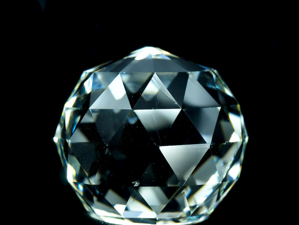 Crystal ball-shaped object with luminous flashes. - Photo, Image