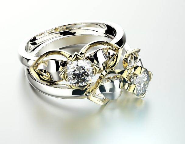 Anéis de noivado dourado com diamante
 - Foto, Imagem