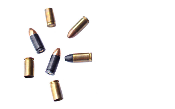 9mm pistol  gun bullets and cartridge cases isolated on white background.  Flat lay. Space for text. Concept : dangerous weapon for shooting.     - Photo, image