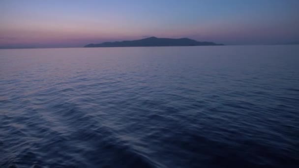Ship leaving Piraeus port on a Beautiful sunset lights, the Ocean is quiet. Shot onboard a boat - Footage, Video
