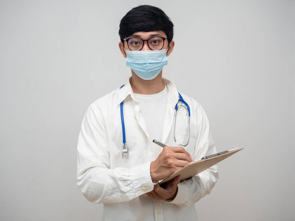 Young doctor hold check list wood board portrait - 写真・画像