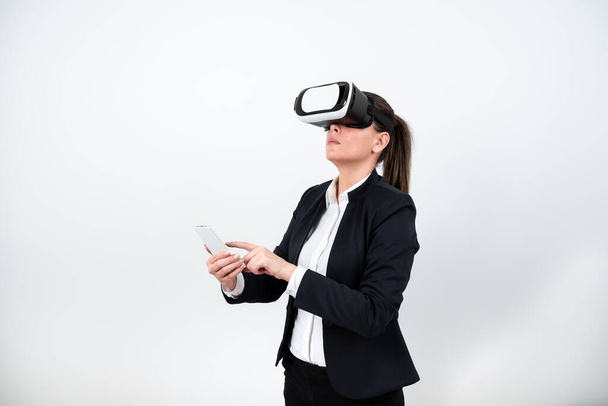 Woman With Vr Glasses And Mobile Phone Pointing On It With One Finger. - Fotó, kép