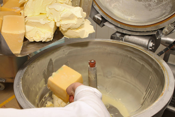 Mixing mass for the production of processed cheese. Cheese production. Technology - Fotó, kép