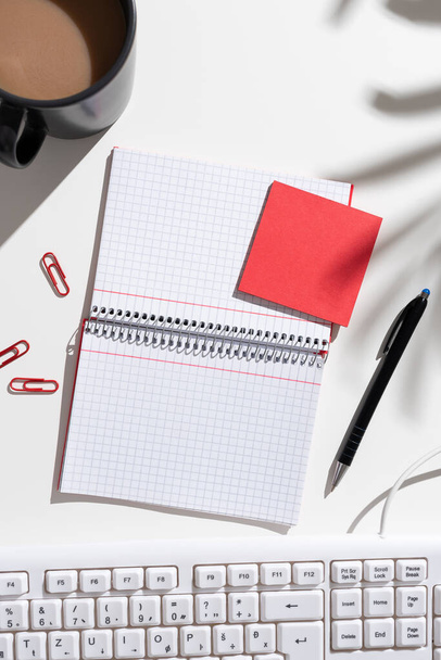 Notebook With New Ideas On Desk With Coffee, Pen, Clips And Memos. - Фото, изображение