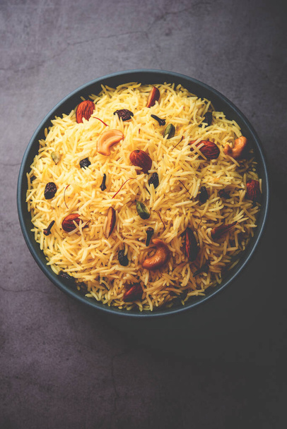Kashmiri sweet modur pulao made of rice cooked with sugar, water flavored with Saffron and dry fruits - Photo, image