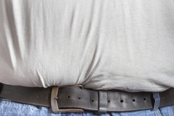 Vista detallada del cinturón en jeans azules
 - Foto, imagen