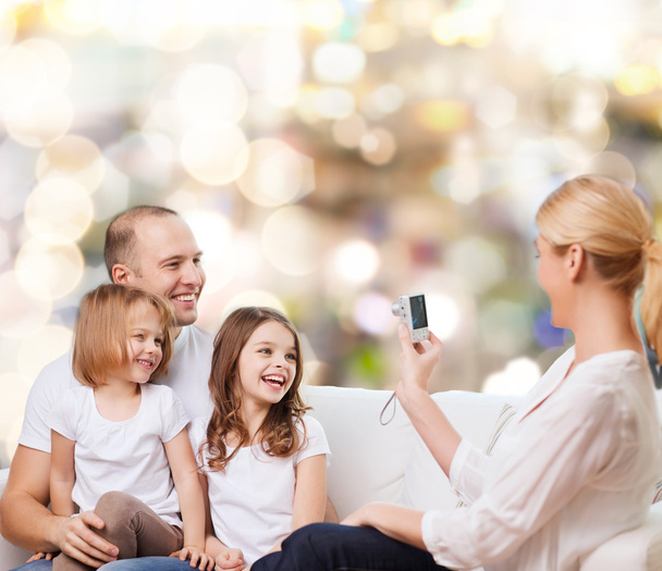 happy family with camera at home - Foto, Imagen