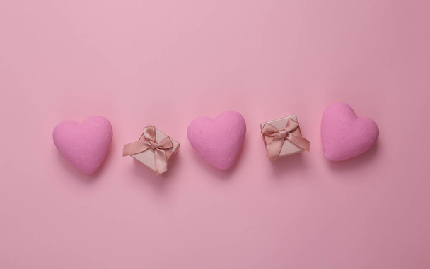 Gift boxes with hearts on a pink background. Love concept. Top view - Foto, immagini