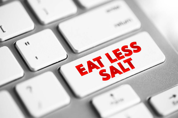 Eat Less Salt text button on keyboard, health concept background - Valokuva, kuva