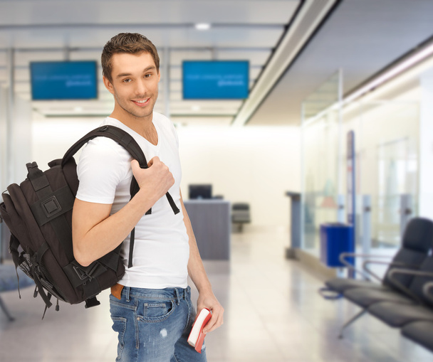 smiling student with backpack and book at airport - Φωτογραφία, εικόνα