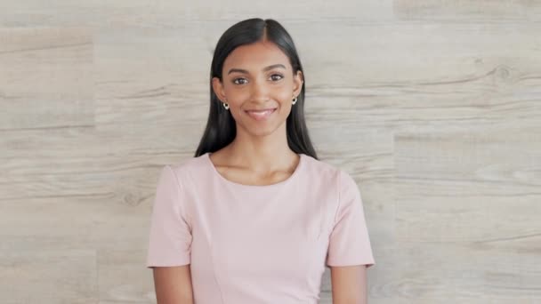 A confident young business woman is happy about her success in the office. Portrait of a happy female entrepreneur with a bright smile. An edgy and elegant corporate professional smiling. - Footage, Video