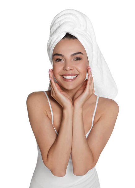 Beautiful young woman with towel on head against white background - Foto, Imagem