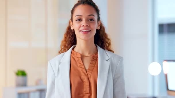 Portrait of a young beautiful woman looking proud and confident while standing in an office at work. One gorgeous, elegant and smiling business woman standing with arms crossed at a startup company. - Felvétel, videó