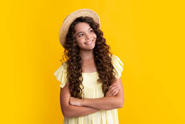 Happy teenager, positive and smiling emotions of teen girl. Emotional portrait of caucasian teenager child girl isolated on studio yellow background - Фото, зображення
