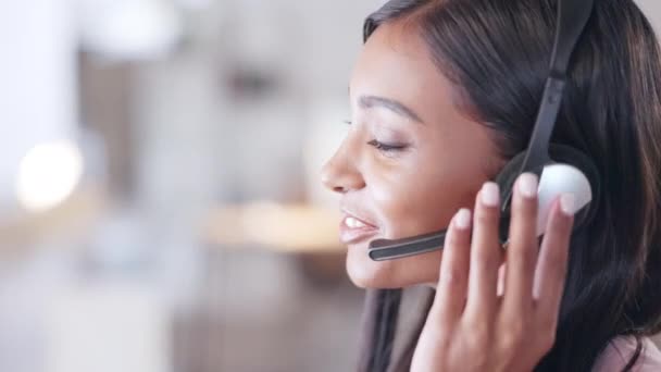 Customer support employee consulting clients online using headset. IT support professional advising a customer. Call center agent helping client in a phone call giving great customer service - Imágenes, Vídeo